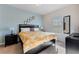 Bright bedroom featuring a king-size bed, and plenty of natural light at 3212 Cupid Pl, Kissimmee, FL 34747
