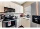 Kitchen with stainless steel appliances and granite countertops at 3212 Cupid Pl, Kissimmee, FL 34747