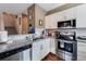 Well-equipped kitchen featuring stainless steel appliances and granite countertops at 3212 Cupid Pl, Kissimmee, FL 34747