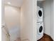 Convenient laundry room with a stackable washer and dryer at 3212 Cupid Pl, Kissimmee, FL 34747