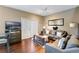 Living room with gray sofas, coffee table, and access to a patio at 3212 Cupid Pl, Kissimmee, FL 34747