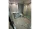 Modern bathroom with marble floors and a glass shower at 322 E Central Blvd # 905, Orlando, FL 32801