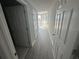 Clean hallway with light wood-look floors and doors to bedrooms at 322 E Central Blvd # 905, Orlando, FL 32801
