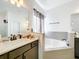 Spa-like bathroom with soaking tub, vanity, and shower at 4408 Renly Ln, Clermont, FL 34711
