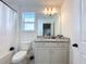 Bathroom with granite countertop and shower/tub combo at 4408 Renly Ln, Clermont, FL 34711