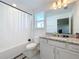 Bright bathroom with granite countertop and bathtub at 4408 Renly Ln, Clermont, FL 34711