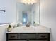 Bathroom with vanity and mirror reflecting hallway at 4408 Renly Ln, Clermont, FL 34711