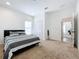 Bright bedroom with double bed and carpet flooring at 4408 Renly Ln, Clermont, FL 34711