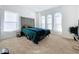Bedroom with plush bed and large windows at 4408 Renly Ln, Clermont, FL 34711