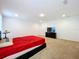 Bedroom with red bedding and a TV at 4408 Renly Ln, Clermont, FL 34711