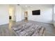 Spacious bonus room with a large TV and access to other rooms at 4408 Renly Ln, Clermont, FL 34711