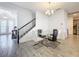 Modern dining room with glass top table and chandelier at 4408 Renly Ln, Clermont, FL 34711