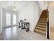 Spacious foyer with tile floors, double doors, and staircase at 4408 Renly Ln, Clermont, FL 34711