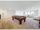 Game room with pool table and comfortable seating at 4408 Renly Ln, Clermont, FL 34711