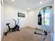 Home gym with exercise bike and punching bag at 4408 Renly Ln, Clermont, FL 34711