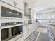 Modern kitchen with stainless steel appliances and granite countertops at 4408 Renly Ln, Clermont, FL 34711
