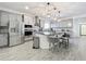 Modern kitchen with stainless steel appliances and an island at 4408 Renly Ln, Clermont, FL 34711