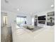 Open living space with white sectional sofa and fireplace at 4408 Renly Ln, Clermont, FL 34711