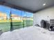 Covered patio with screened enclosure and grill at 4408 Renly Ln, Clermont, FL 34711