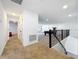 Upstairs hallway leading to bedrooms and game room at 4408 Renly Ln, Clermont, FL 34711