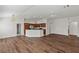 Spacious kitchen with wood-style flooring and island counter at 719 Richfield St, The Villages, FL 32163