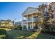 Two-story home with a large backyard, a patio, and a pool at 7513 Excitement Dr, Reunion, FL 34747