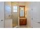 Bathroom with a walk-in shower and granite vanity at 7513 Excitement Dr, Reunion, FL 34747