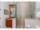 Bathroom with a large walk-in shower and granite vanity at 7513 Excitement Dr, Reunion, FL 34747