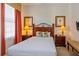 Bedroom with a queen-size bed and wood furniture at 7513 Excitement Dr, Reunion, FL 34747