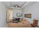 Common area with seating, TV, and access to hallway at 7513 Excitement Dr, Reunion, FL 34747