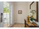 Elegant entryway with a console table and mirror at 7513 Excitement Dr, Reunion, FL 34747