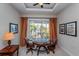 Game room with a round table, seating, and views of the backyard at 7513 Excitement Dr, Reunion, FL 34747