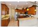 Spacious kitchen with granite countertops and stainless steel appliances at 7513 Excitement Dr, Reunion, FL 34747