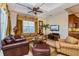 Relaxing living room featuring a cozy sofa, armchairs, and a coffee table at 7513 Excitement Dr, Reunion, FL 34747