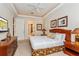 Large main bedroom with a king-size bed and an en-suite bathroom at 7513 Excitement Dr, Reunion, FL 34747