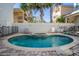 Kidney-shaped pool with a spa and ample surrounding space at 7513 Excitement Dr, Reunion, FL 34747