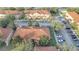 Aerial view of townhouses with parking and landscaping at 7606 Acklins Rd, Kissimmee, FL 34747