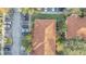 Top-down view of a townhome building with terracotta roofs and surrounding parking at 7606 Acklins Rd, Kissimmee, FL 34747