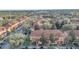 Aerial view of townhouses with tile roofs, and community pool at 7606 Acklins Rd, Kissimmee, FL 34747