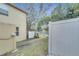 View of backyard with fence and access to community area at 7606 Acklins Rd, Kissimmee, FL 34747