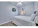 Cozy bedroom with a double bed, TV, and window at 7606 Acklins Rd, Kissimmee, FL 34747