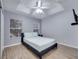 Primary bedroom with ceiling fan and ensuite bathroom at 7606 Acklins Rd, Kissimmee, FL 34747