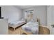 Bedroom with two twin beds and light wood flooring at 7606 Acklins Rd, Kissimmee, FL 34747