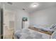 Upstairs bedroom with twin beds and a dresser at 7606 Acklins Rd, Kissimmee, FL 34747
