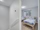 Upstairs bedroom with twin beds and a window at 7606 Acklins Rd, Kissimmee, FL 34747