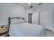 Bedroom with a queen bed and light flooring at 7606 Acklins Rd, Kissimmee, FL 34747