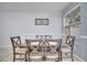Bright dining room with wood table and six chairs at 7606 Acklins Rd, Kissimmee, FL 34747
