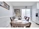 Dining area with a dark wood table and white placemats at 7606 Acklins Rd, Kissimmee, FL 34747
