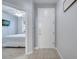 Inviting entryway with tiled floor and view of bedroom at 7606 Acklins Rd, Kissimmee, FL 34747