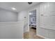 Upstairs hallway with bathroom and bedroom access at 7606 Acklins Rd, Kissimmee, FL 34747